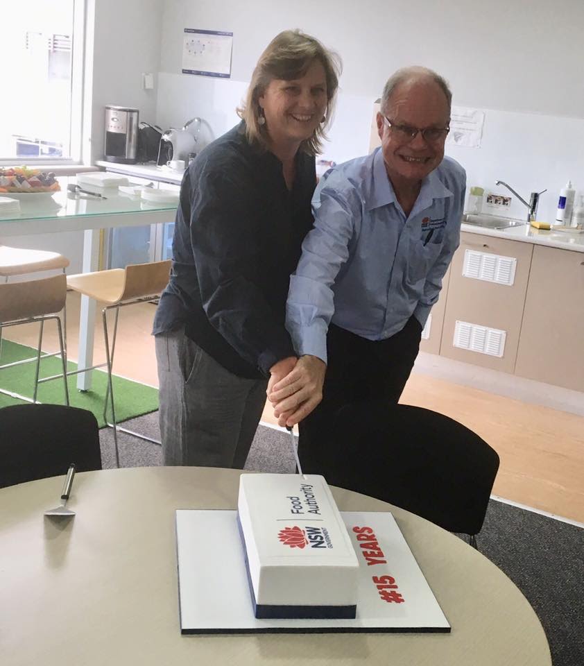 Image of birthday cake cut by Lisa Szabo and Brett Campbell