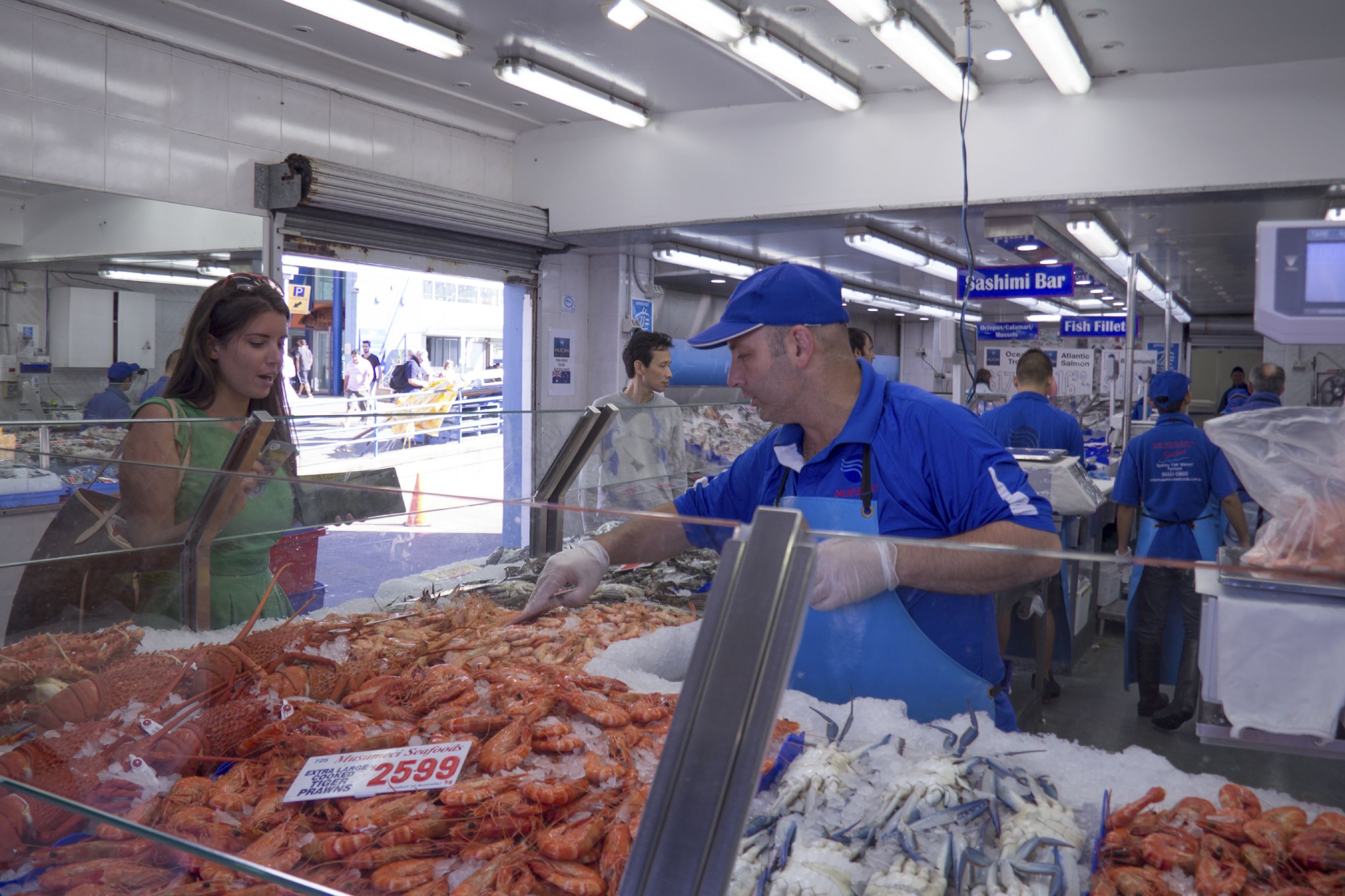 Purchasing prawns at a seafood shop