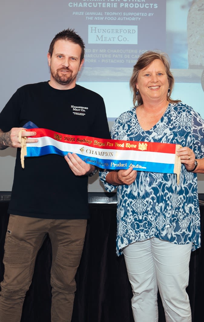 NSW Food Authority CEO Lisa Szabo presents the award to Michael Robinson, owner of Hungerford Meat Co. based in Branxton.