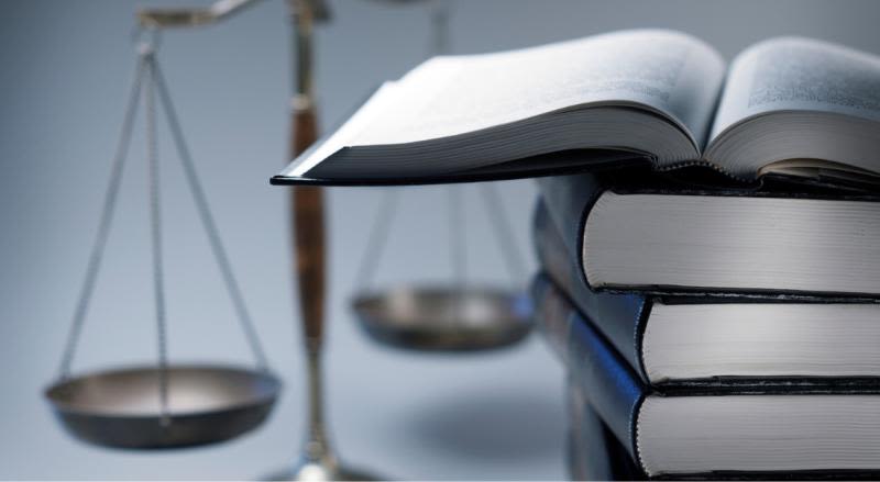 Scales of justice and law books.